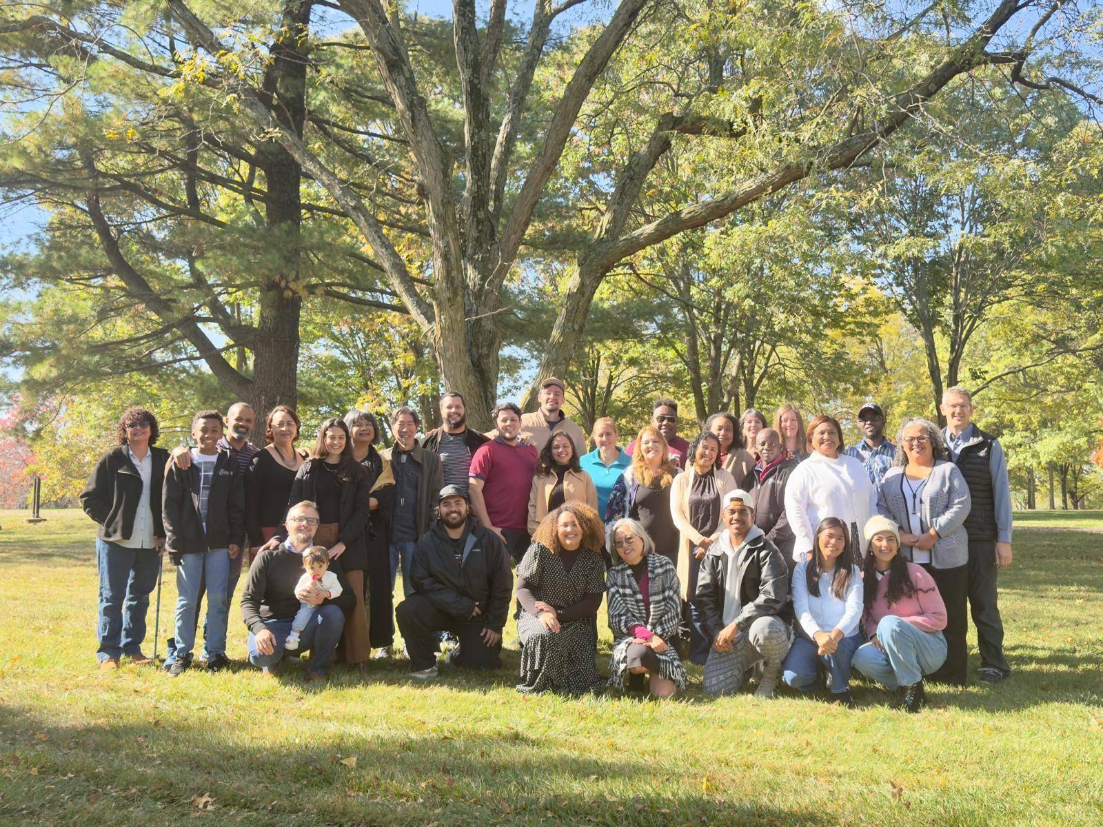 Bible translation mentors and facilitators gathered outdoors at the YWAM Kansas City base