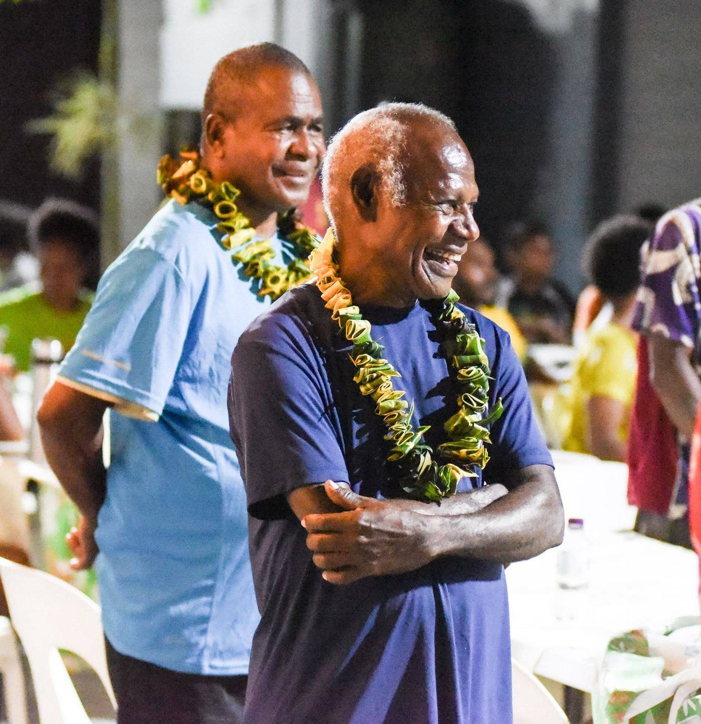 Two Oral Bible Translation team members celebrating together in Papua New Guinea