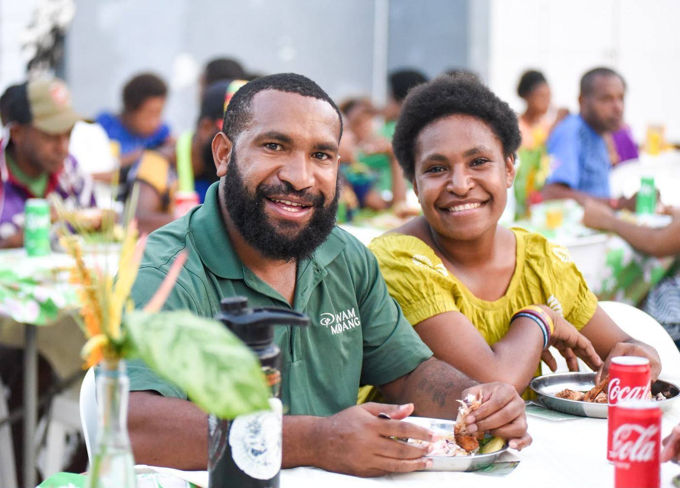 Members of an Oral Bible Translation team sharing a meal in Papua New Guinea