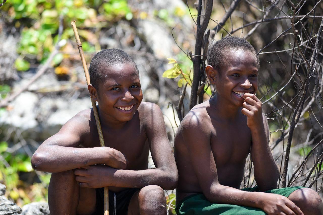 Two smiling boys from a community in Papua New Guinea